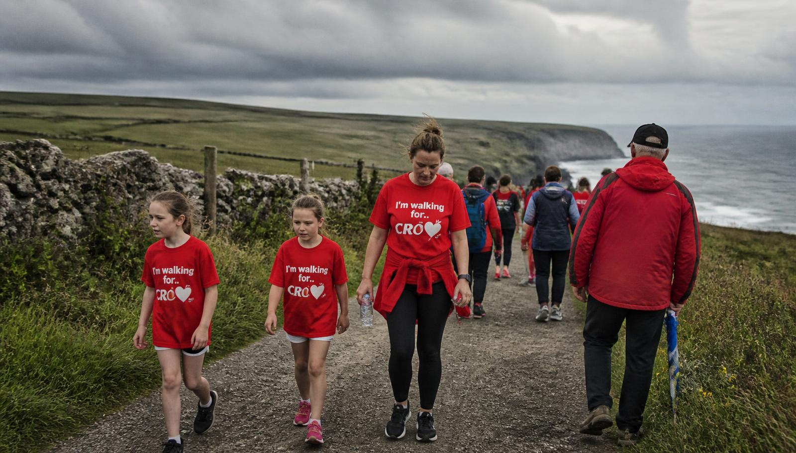Families walking a coastal charity route in County Clare